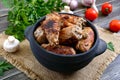 Tasty meat rolls with mushrooms in a ceramic pot on a wooden background Royalty Free Stock Photo