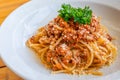 Tasty minced beef spaghetti decorated with parsley and cheese