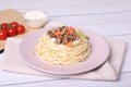 Tasty minced meat with spaghetti and vegetables on white wooden table Royalty Free Stock Photo