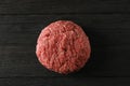 Tasty minced meat on wooden background