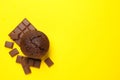 Tasty muffin and chocolate on yellow background top view Royalty Free Stock Photo