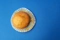 Tasty muffin closeup on a blue paper background Royalty Free Stock Photo