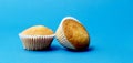 Tasty muffin closeup on a blue paper background, top view Royalty Free Stock Photo