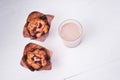 Tasty muffin closeup  on a wooden board and delicious, natural cocoa drink with  chocolate and milk in a glass mug , nut muffin, Royalty Free Stock Photo