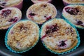 Tasty muffins with cream, berries and a nut crumb