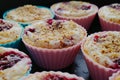 Tasty muffins with cream, berries and a nut crumb