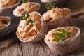 Tasty muffins with ham and cheese close-up. Horizontal