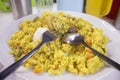 Tasty Nigerian Fried Rice with a boiled egg and chopped meat