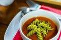 Tasty and nutritious tomato soup with fresh pasta, dietary meal Royalty Free Stock Photo