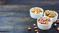 Tasty nuts arrangement in a bowl on a wooden table. Healthy food and snack, organic vegetarian food. Walnut, almond