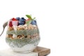 Tasty oatmeal with chia matcha pudding and berries on white tiled table, closeup. Space for text. Healthy breakfast Royalty Free Stock Photo