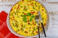 Tasty omelette with chives, bell pepper and cauliflower. Close up