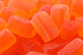 Tasty orange jelly candies as background, closeup Royalty Free Stock Photo