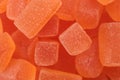 Tasty orange jelly candies as background, closeup Royalty Free Stock Photo