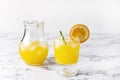 Tasty Orange Juice in Glass With Ice Cube Blue and White Background Fresh Oranges Horizontal Royalty Free Stock Photo