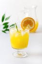 Tasty Orange Juice in Glass With Ice Cube Blue and White Background Fresh Oranges Vertical Royalty Free Stock Photo