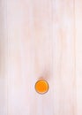 Tasty orange juice on a light wooden background. A top view of a fresh citrus beverage. Natural cocktail for summer. Royalty Free Stock Photo