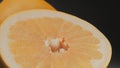 Tasty orange pomelo fruit, orange lith pulp rotating closeup