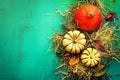 Tasty Orange Pumpkins on Hay Autumn Leaves on Beautiful Turquoise Background Top View
