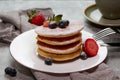 Tasty pancake with sugar powder and fresh strawberries slices Royalty Free Stock Photo