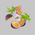 Tasty passion fruits, passiflora leaves and flower falling on light grey background