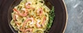 Tasty pasta with shrimps, Italian pasta fettuccine with grilled shrimps, bechamel sauce and thyme, banner, menu recipe place for Royalty Free Stock Photo