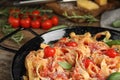 Tasty pasta with tomatoes, cheese and basil on table, closeup Royalty Free Stock Photo