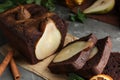 Tasty pear bread with cinnamon on table, closeup. Homemade cake