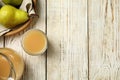 Tasty pear juice and fruits on white wooden table, flat lay. Space for text Royalty Free Stock Photo