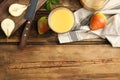 Tasty pear juice and fruits on wooden table, flat lay. Space for text Royalty Free Stock Photo