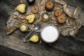 Tasty pears Cookies and milk on wooden table