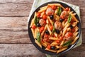 Tasty penne with meatballs, olives and tomato sauce closeup. Horizontal top view Royalty Free Stock Photo