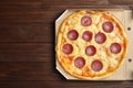 Tasty pepperoni pizza in cardboard box on table, top view. Space for text Royalty Free Stock Photo