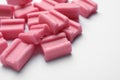 Tasty pink chewing gums on white background, closeup. Space for text Royalty Free Stock Photo