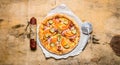 Tasty pizza with bacon and tomatoes. On wooden table. Royalty Free Stock Photo