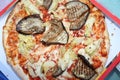 tasty pizza with eggplant and artichoke