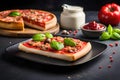 Tasty Pizza with Mozzarella cheese, salami, Tomatoes, pepper, Spices and Fresh Basil. Italian pizza Royalty Free Stock Photo