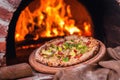 Tasty pizza out of oven in restaurant kitchen Royalty Free Stock Photo