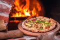 Tasty pizza out of oven in restaurant kitchen Royalty Free Stock Photo