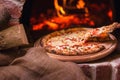 Tasty pizza out of oven in restaurant kitchen Royalty Free Stock Photo