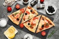 Tasty pizza with seafood and ingredients on table, flat lay Royalty Free Stock Photo
