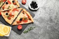 Tasty pizza with seafood and ingredients on table, flat lay. Space for text Royalty Free Stock Photo