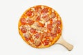 Tasty pizza Spicy pepper served on a wooden plate, ingredients Signature sauce, mozzarella cheese, pepperoni, pickled Royalty Free Stock Photo