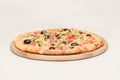 Tasty pizza with vegetables, chicken and olives