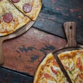 tasty pizzas on wooden background Royalty Free Stock Photo