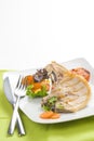 Tasty pork chop with corn carrot tomato Royalty Free Stock Photo