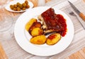 Pork ribs baked under sauce, served with potatoes Royalty Free Stock Photo