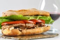 Tasty pork steak sandwich in a ciabatta with tomatos, lettuce Royalty Free Stock Photo