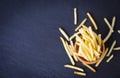 Tasty potato fries for food or snack delicious Italian menu homemade ingredients - Fresh french fries on wooden bowl and black Royalty Free Stock Photo