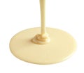 Tasty pouring condensed milk on white. Dairy product